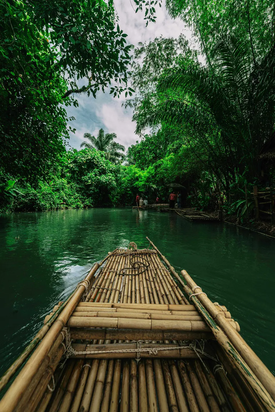 Bamboo rafting on a river in Mankulam