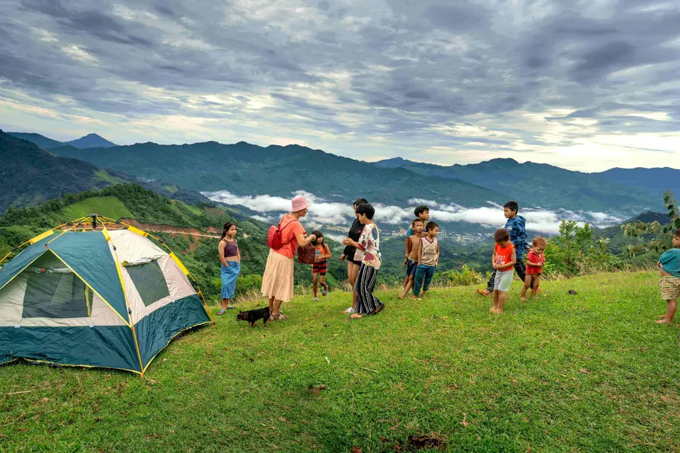 Group camping on a green meadow