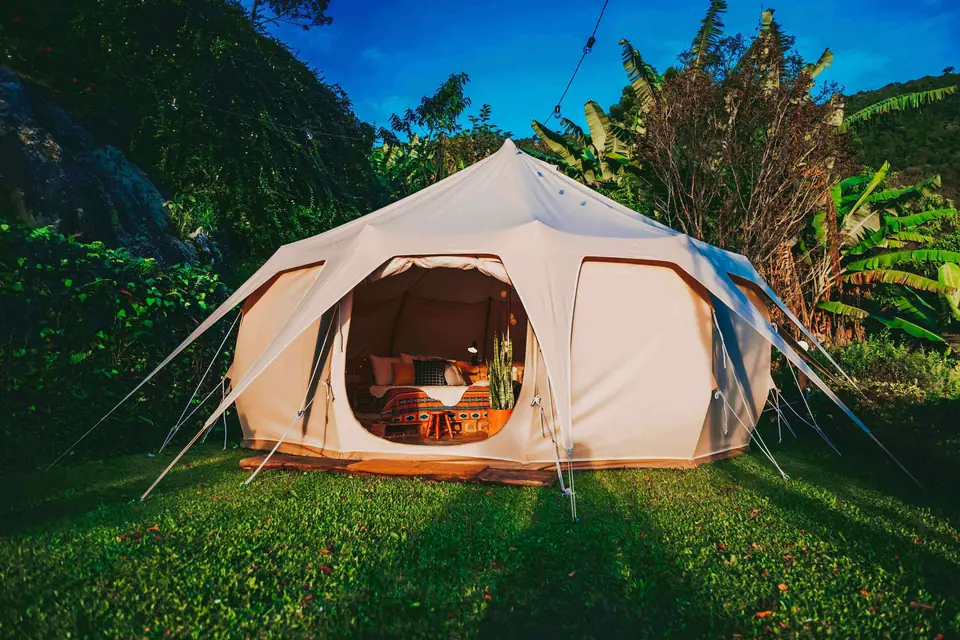 Glamping tent on a lawn in the Munnar hills
