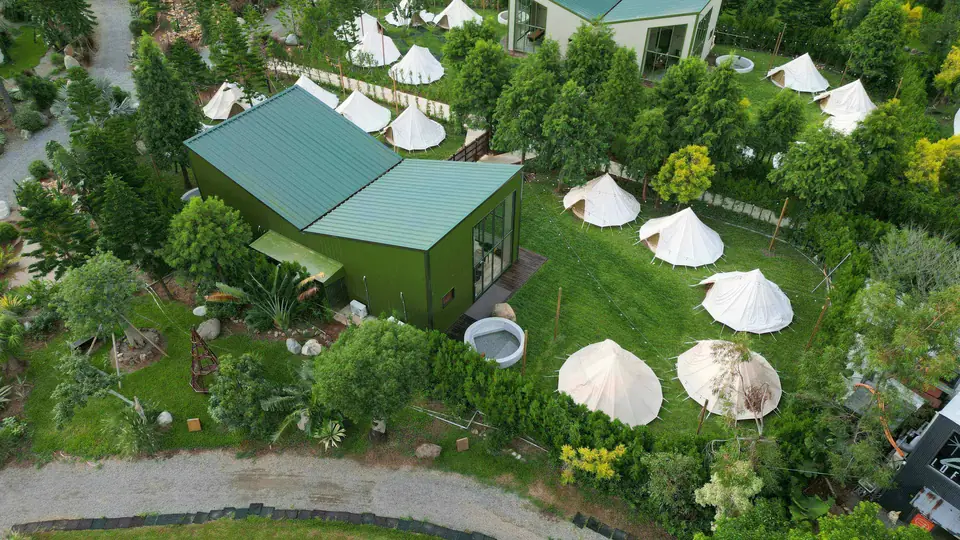 Hillside resort with white dome tents
